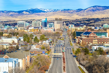 EB-5 Regional Center in Idaho. Photo of downtown Boise, Idaho with mountains in the background.
