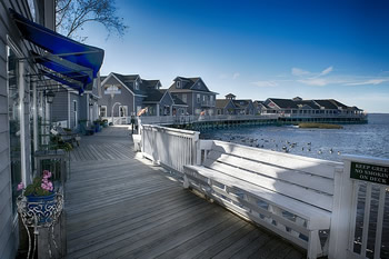 EB-5 Regional Center in North Carolina. Photo of homes on a stretch of boardwalk along the water, Outer Banks, North Carolina.