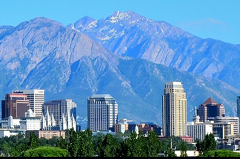EB-5 Regional Center in Utah. Photo of downtown Salt Lake City, Utah with mountains in the background.